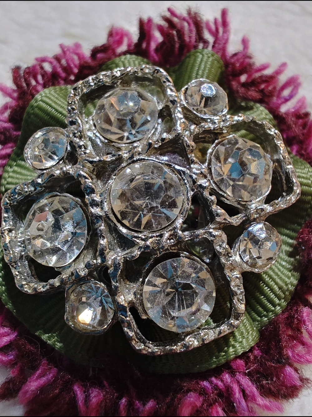 Magpie clear crystal floral brooch with green and magenta ribbon